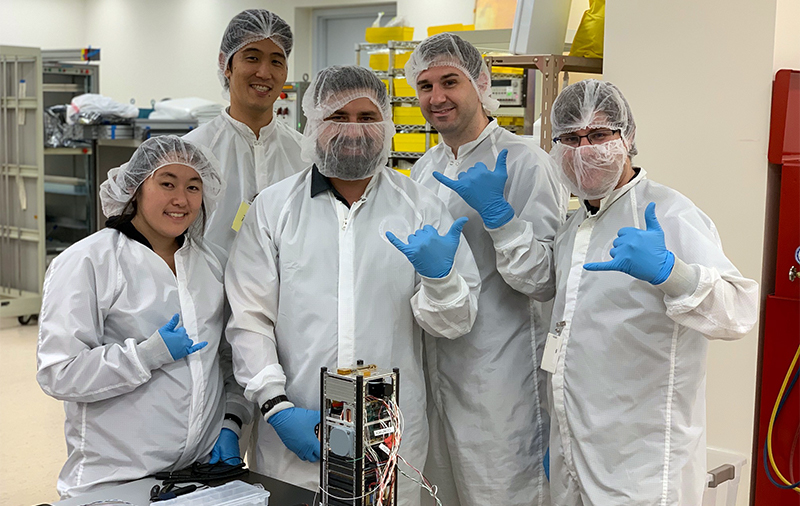 hawaii space flight lab students with their micro satellite