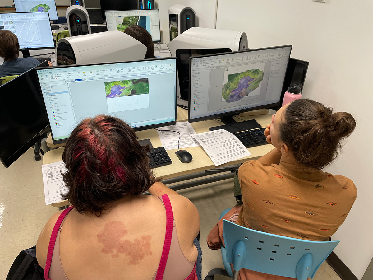 Students explore mapping technology software at the Spatial Data Analysis and Visualization (SDAV) Lab at UH Hilo on GIS Day 2025.