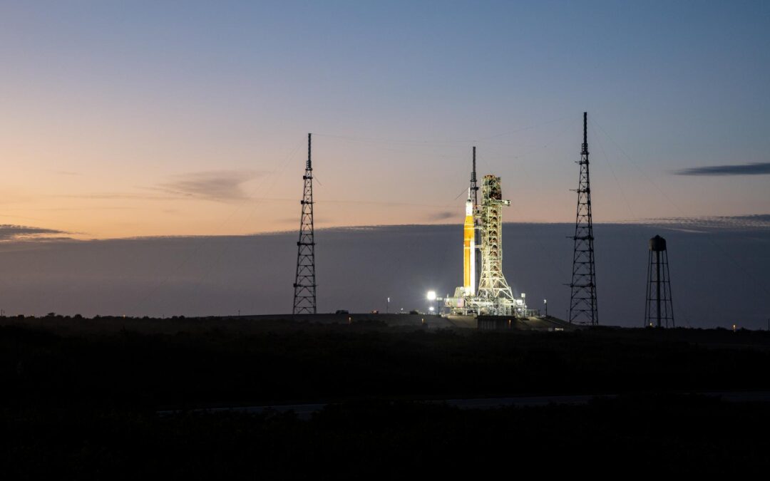 The Space Launch System rocket and Orion spacecraft stacked on the launchpad at Kennedy Space Center in Florida.