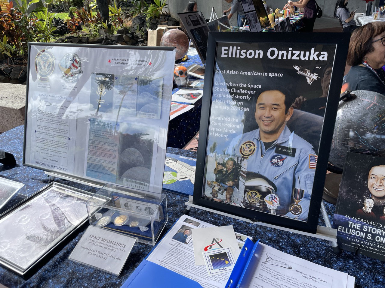 A table shows a portrait of Ellison Onizuka in the exhibit hall at Onizuka Science Day 2026.